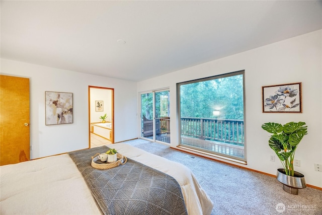 bedroom featuring access to exterior, carpet flooring, visible vents, and baseboards