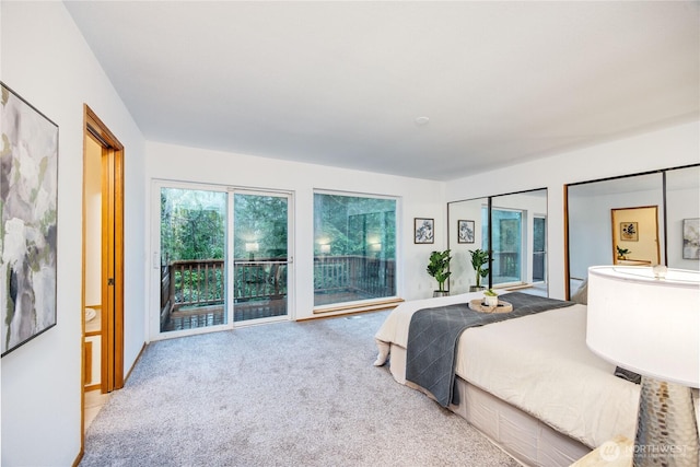 carpeted bedroom featuring access to outside