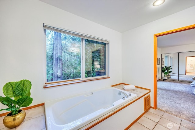 bathroom featuring a bath and tile patterned floors