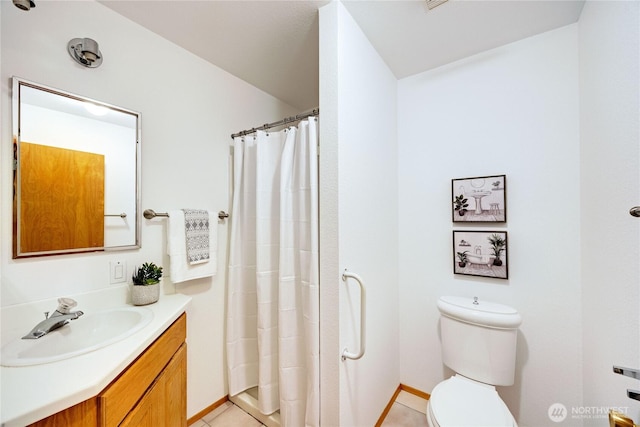 bathroom featuring toilet, a shower with curtain, vanity, and tile patterned floors