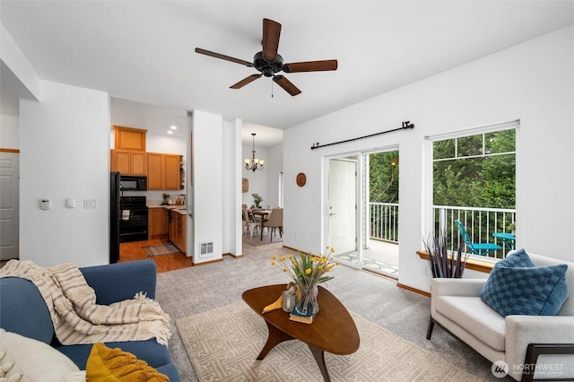 living area with light colored carpet, visible vents, and baseboards