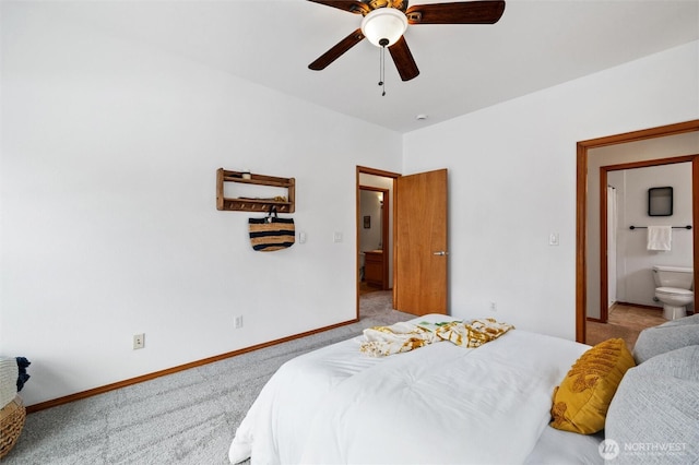 carpeted bedroom with ceiling fan, connected bathroom, and baseboards