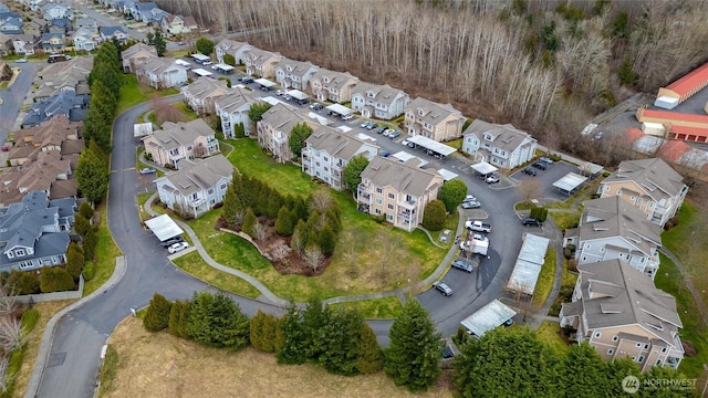 birds eye view of property with a residential view