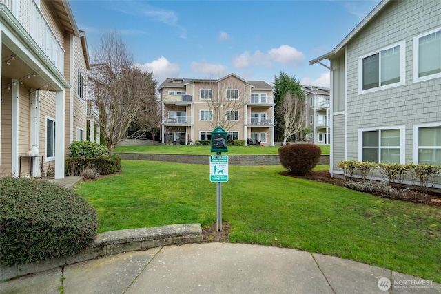 view of community featuring a lawn