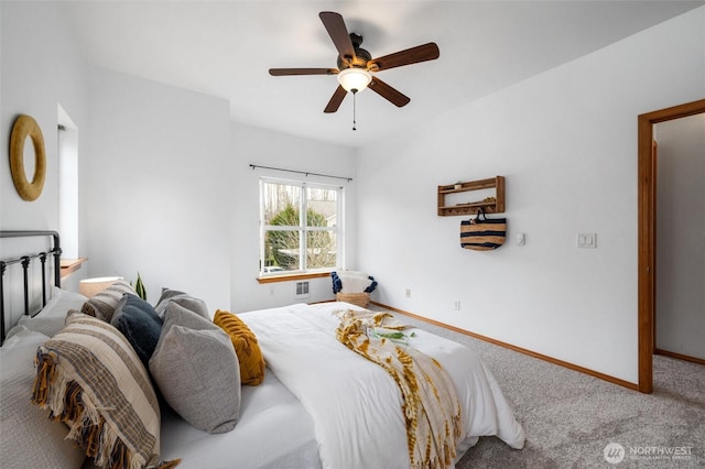 carpeted bedroom featuring a ceiling fan and baseboards