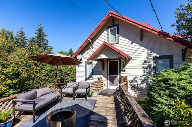 exterior space with outdoor lounge area and a wooden deck