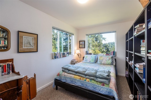 carpeted bedroom with baseboards