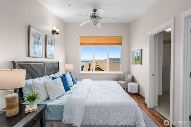 bedroom featuring a ceiling fan and wood finished floors