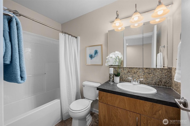 bathroom featuring toilet, tasteful backsplash, shower / bath combo with shower curtain, and vanity