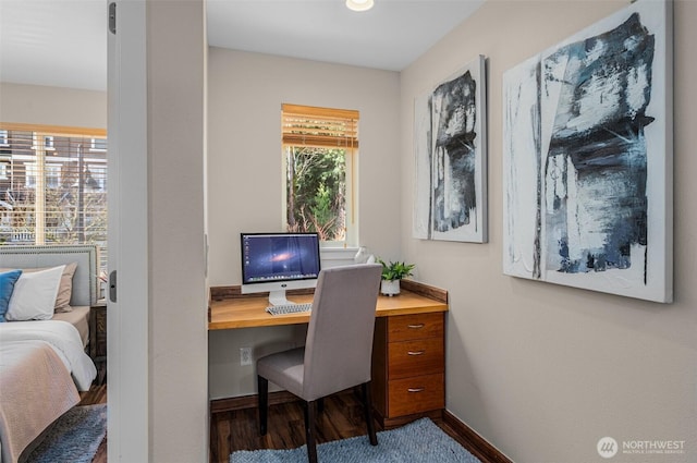 home office with wood finished floors and baseboards