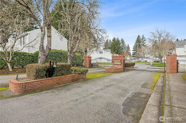 view of street featuring a gate and a gated entry