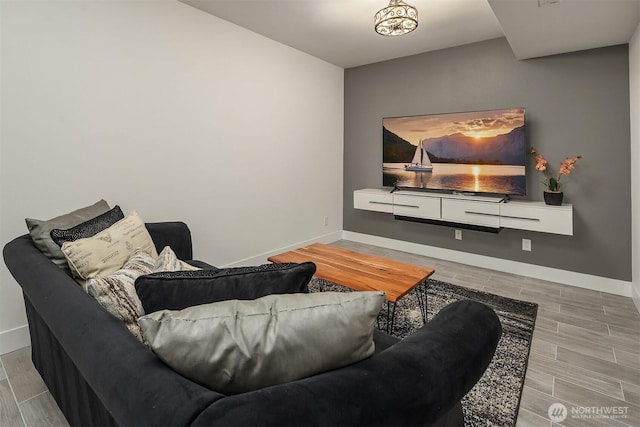 living area with wood finish floors and baseboards