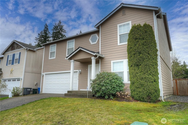 traditional-style home featuring a garage, aphalt driveway, and a front lawn