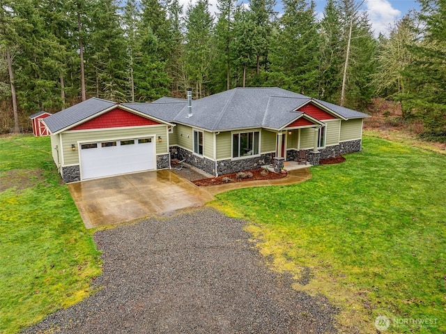 view of front of property featuring stone siding, driveway, and a front lawn