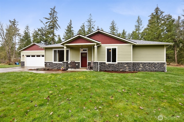 craftsman house featuring a garage, a front yard, stone siding, and concrete driveway