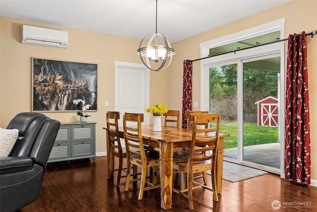 dining space with dark wood-type flooring, a wall unit AC, a notable chandelier, and baseboards