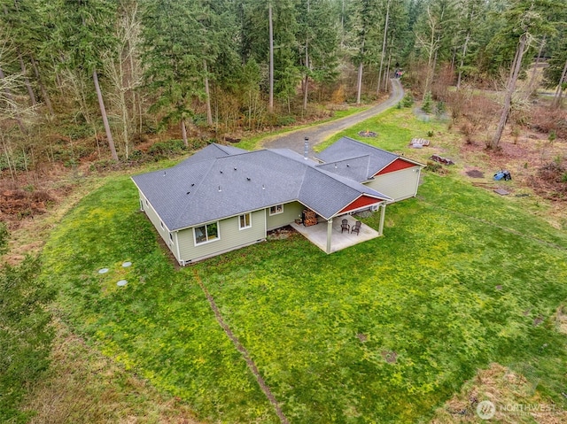 bird's eye view featuring a forest view