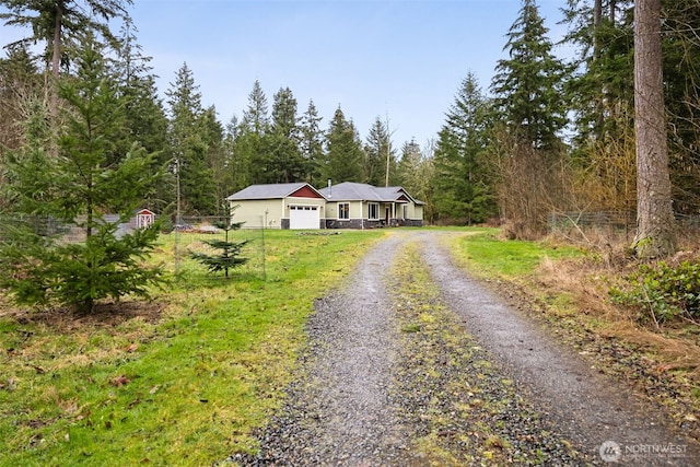 view of front of property featuring a garage and driveway