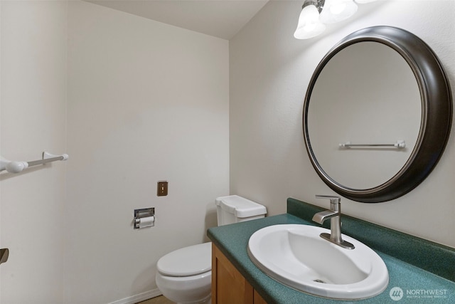 bathroom with toilet and vanity