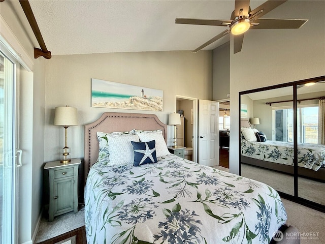 carpeted bedroom with baseboards, a ceiling fan, and vaulted ceiling