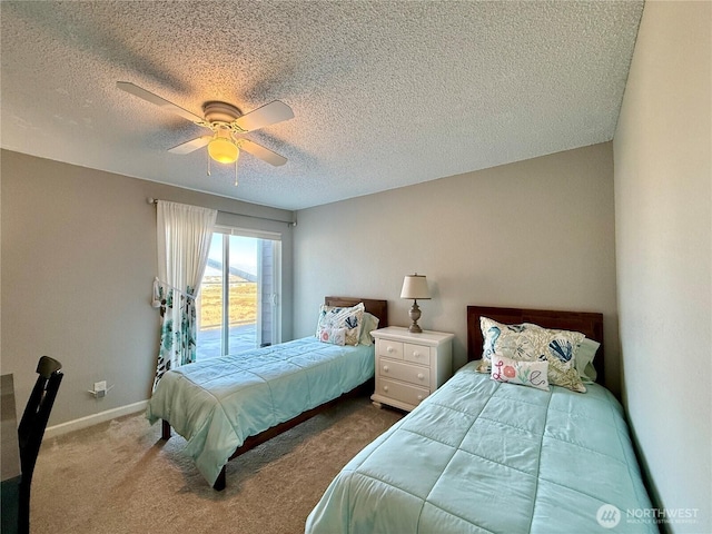 bedroom featuring a ceiling fan, baseboards, carpet floors, a textured ceiling, and access to outside