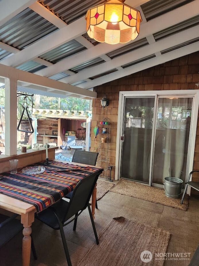 sunroom / solarium with vaulted ceiling