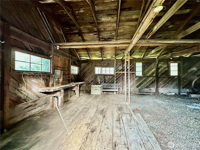 attic featuring a healthy amount of sunlight