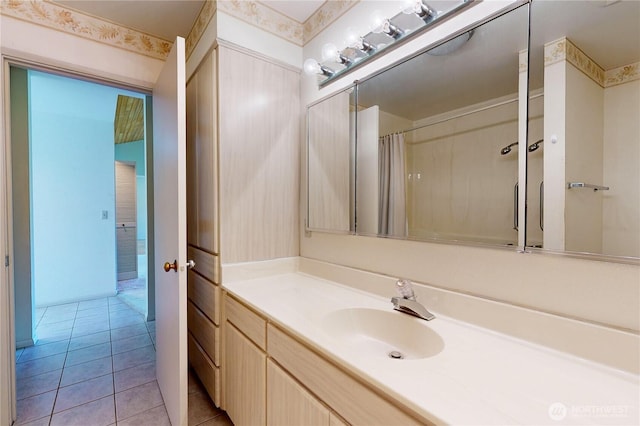 full bathroom with wallpapered walls, vanity, curtained shower, and tile patterned floors