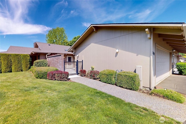 view of property exterior featuring driveway, a lawn, and an attached garage