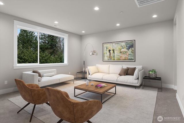 carpeted living room with recessed lighting, visible vents, and baseboards