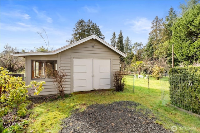 view of shed with fence