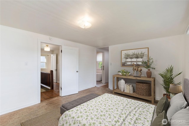 bedroom featuring baseboards