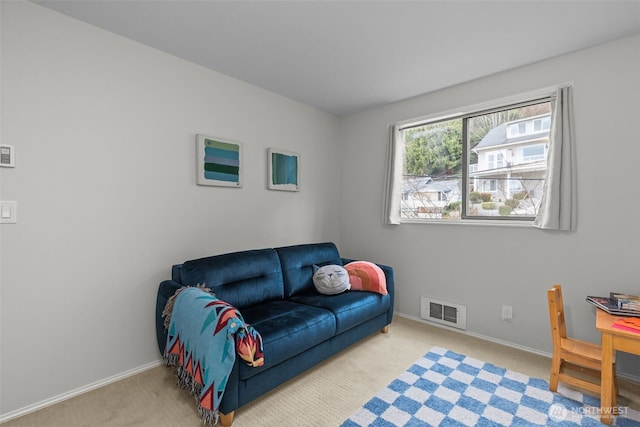 interior space with carpet, visible vents, and baseboards