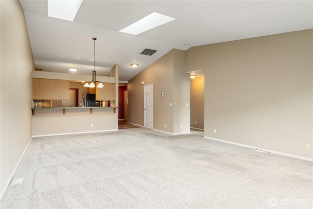 unfurnished living room with lofted ceiling, baseboards, light carpet, and visible vents