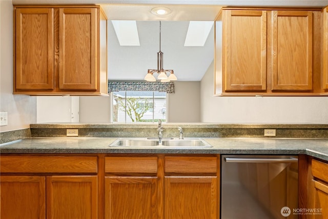 kitchen with a sink, dark countertops, brown cabinets, and dishwasher