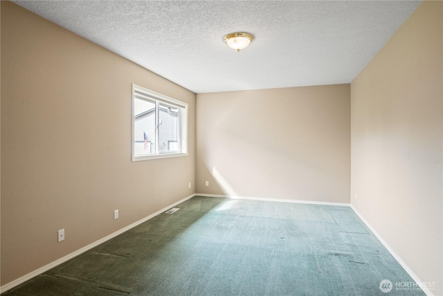 carpeted empty room featuring a textured ceiling, visible vents, and baseboards