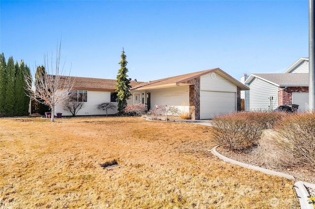 ranch-style home with driveway and an attached garage