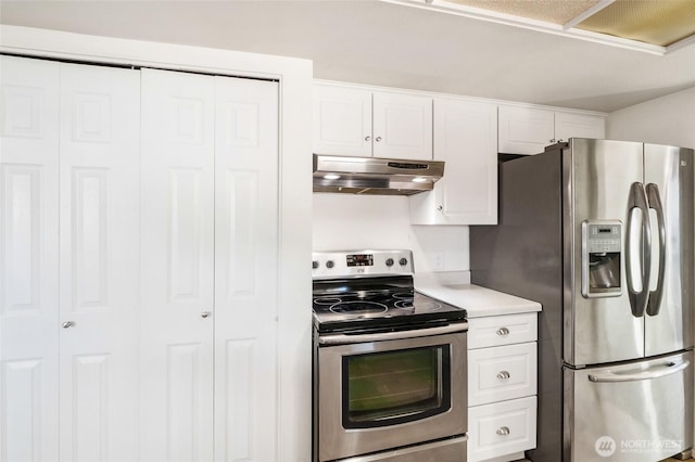 kitchen with under cabinet range hood, white cabinetry, and stainless steel appliances