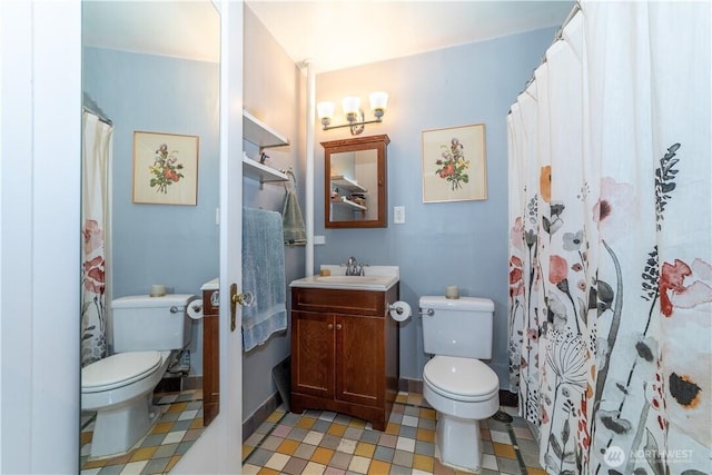 full bath featuring vanity and toilet