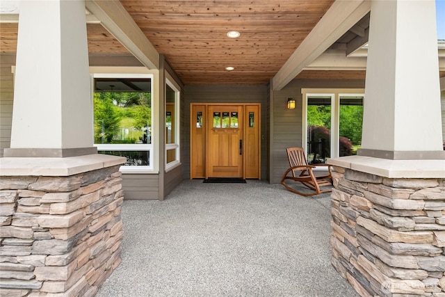 entrance to property featuring a porch