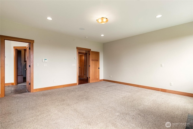 unfurnished room featuring carpet floors, baseboards, and recessed lighting