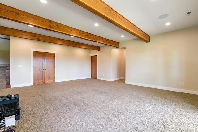 empty room with carpet floors, baseboards, beamed ceiling, and recessed lighting