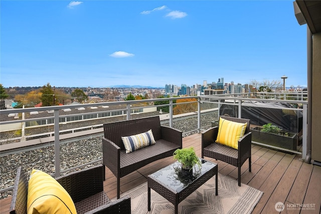 deck with a city view and an outdoor hangout area