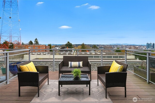 wooden terrace featuring outdoor lounge area