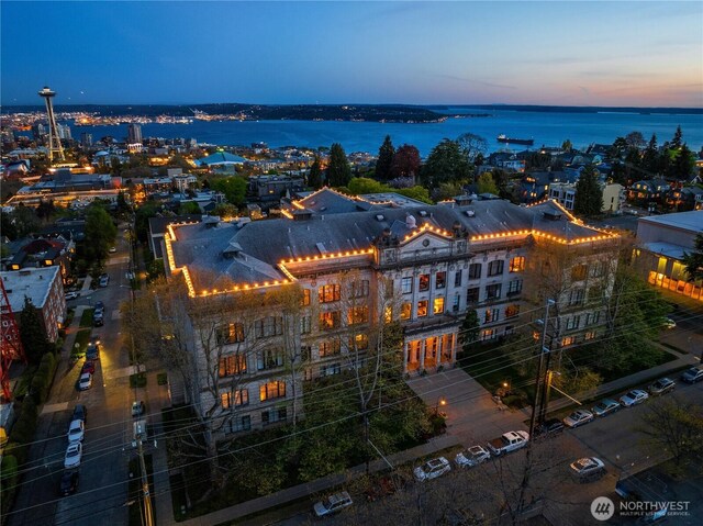 birds eye view of property with a water view