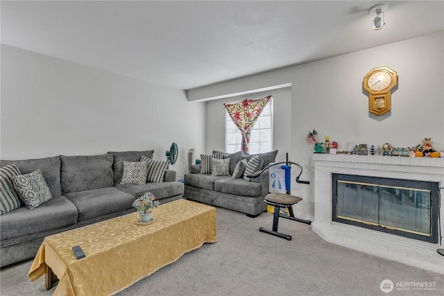 living area featuring carpet and a fireplace