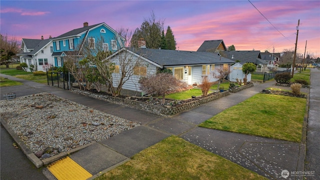 view of front of house with a residential view and a front yard