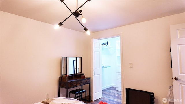 bedroom featuring dark wood-style flooring