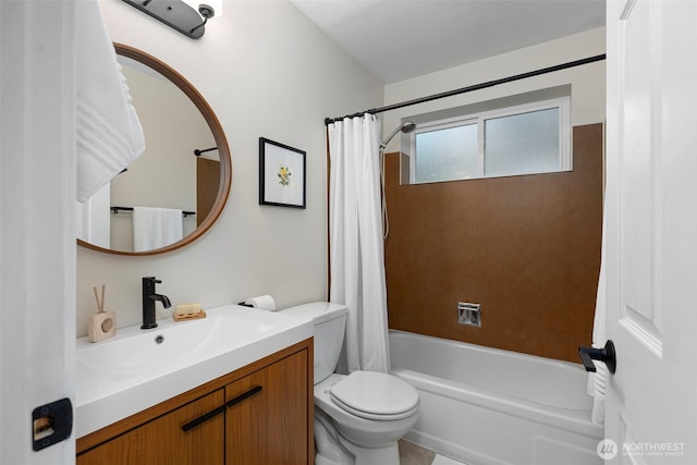 bathroom featuring vanity, toilet, and shower / tub combo