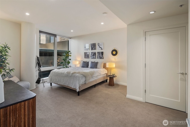 bedroom featuring recessed lighting, baseboards, and light colored carpet